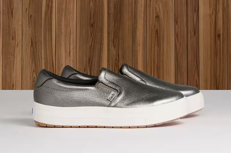 A side view of the Park Metallic Leather Slip-On in gunmetal.