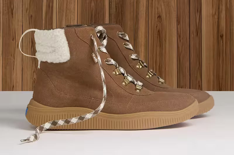 A side view of the Nova Suede/Faux Shearling Lace-Up Boot in cognac.